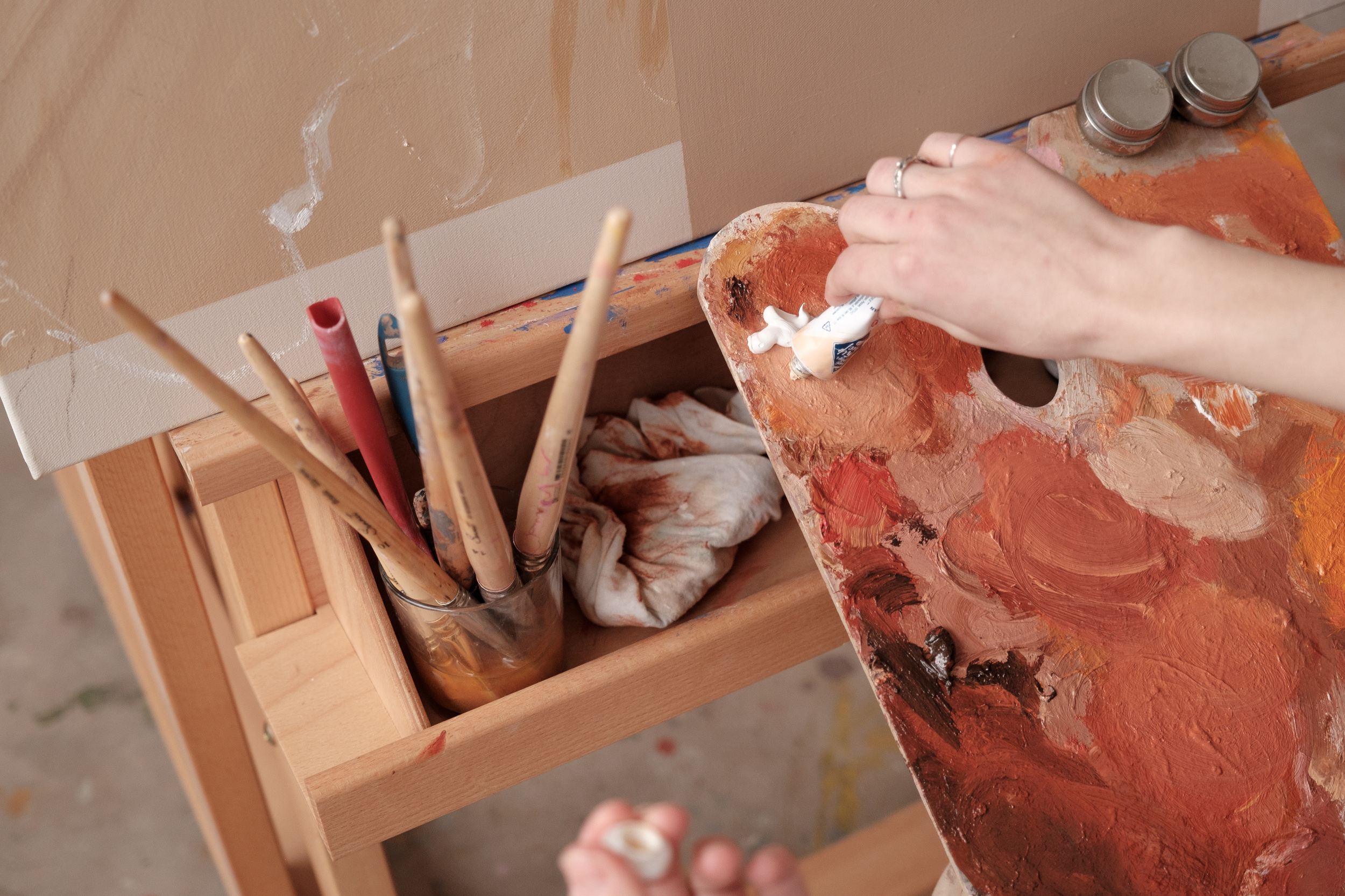 Artist Putting Paint on a Palette 