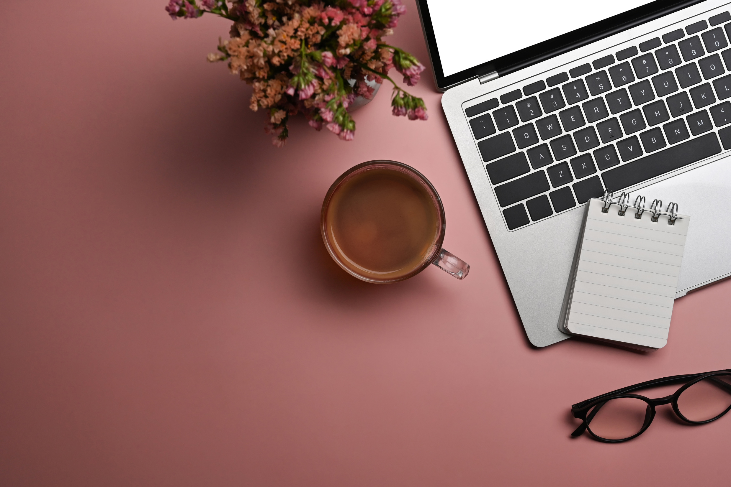 Flat lay, laptop computer, coffee cup, glasses and dry flowe