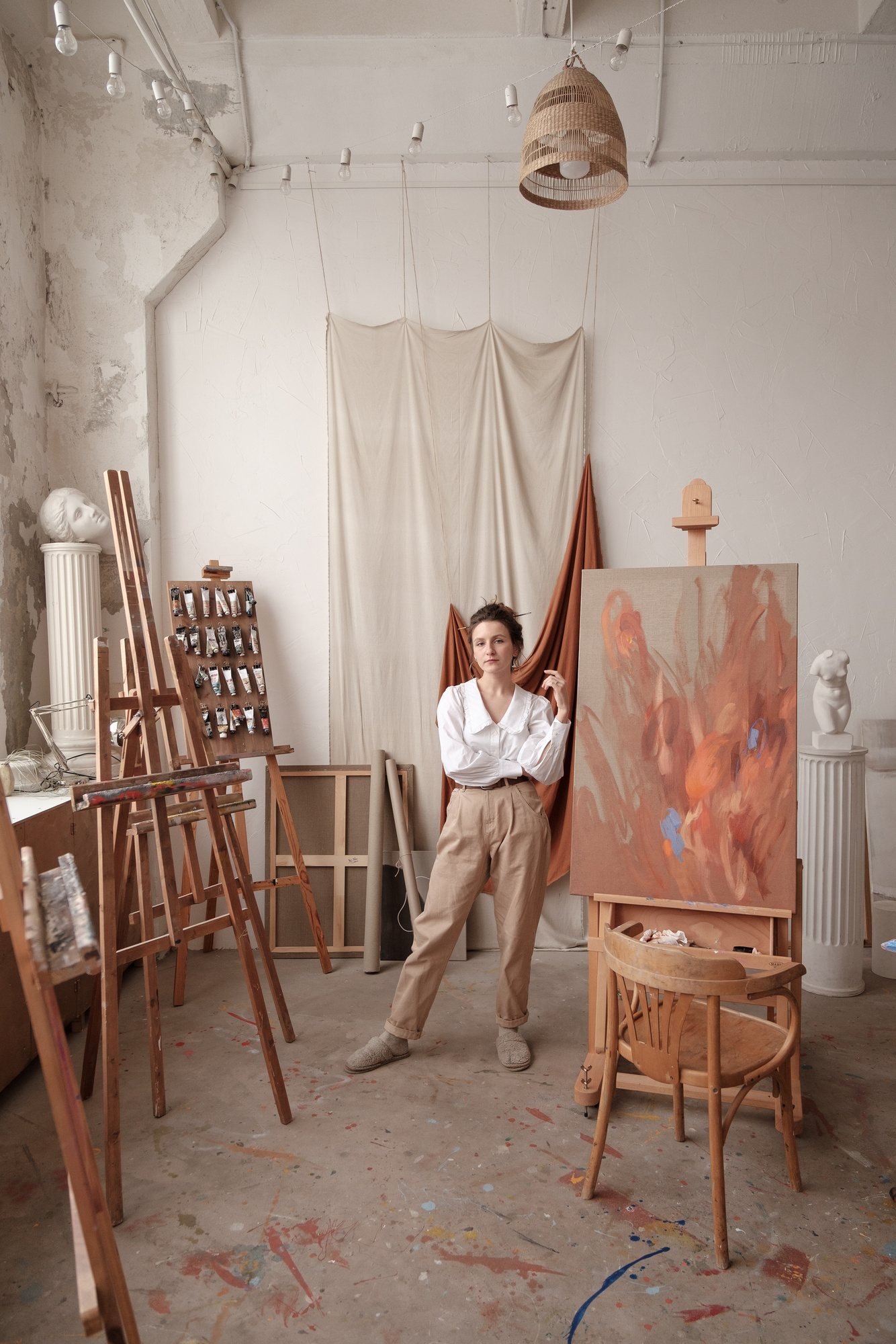Female Artist with Painting in Studio