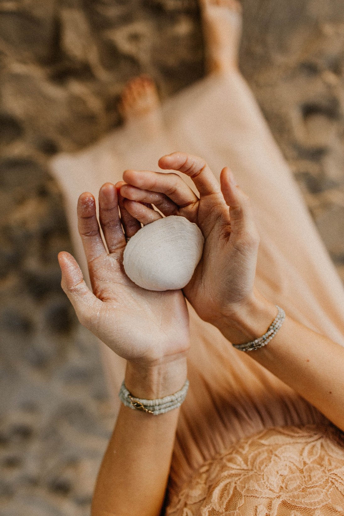 Woman Holding Seashell in her Palm